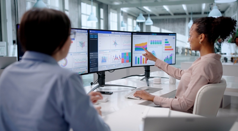 Analysts viewing AI dashboards