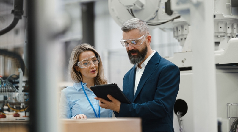 Supply chain business professionals discussing industrialization