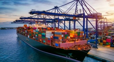 Cargo ship waiting at dock amid Section 122 Tariffs