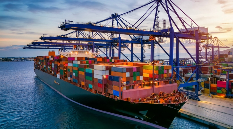 Cargo ship waiting at dock amid Section 122 Tariffs