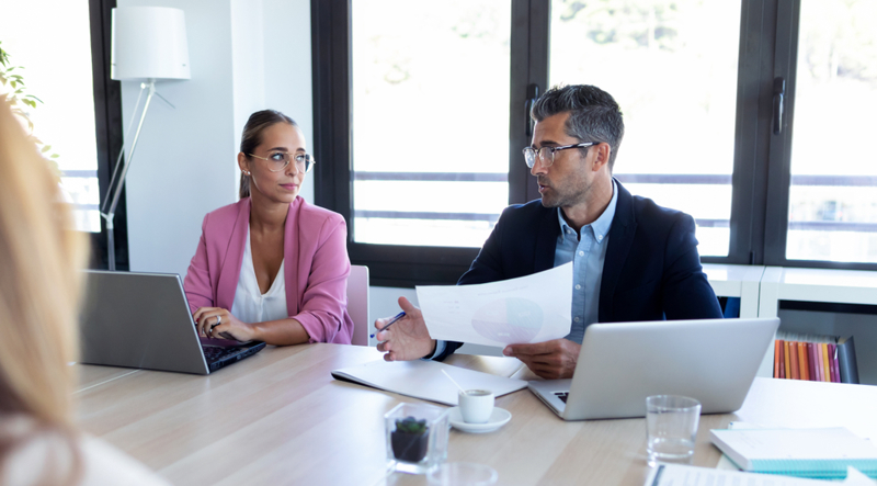 Organization leaders meeting about adopting AI