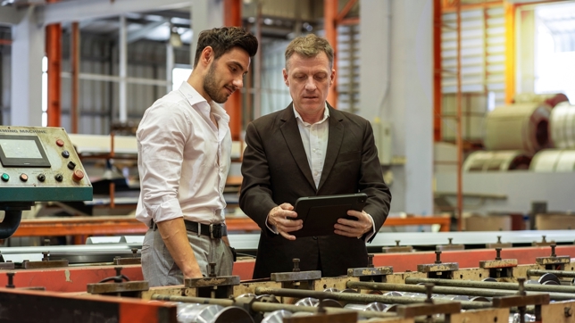 Business owner showing tariff plan with CFO 