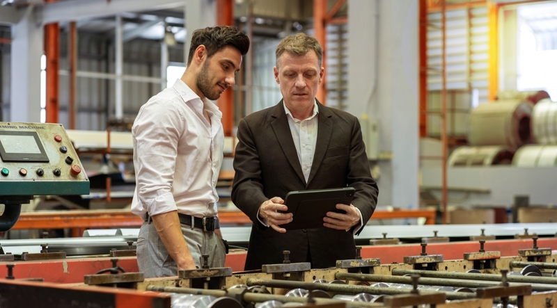 Business owner showing tariff plan with CFO 
