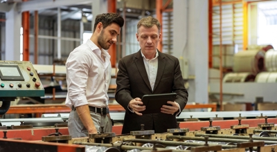 Business owner showing tariff plan with CFO 
